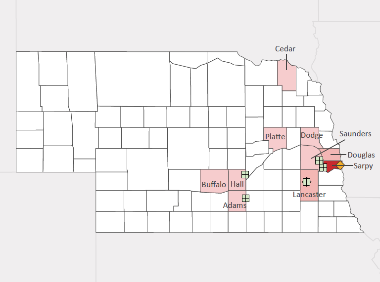 Map presenting top defense personnel spending locations within the state of Nebraska with an overlay showing the positions of key military installations differentiated by service and active/reserve affiliation.