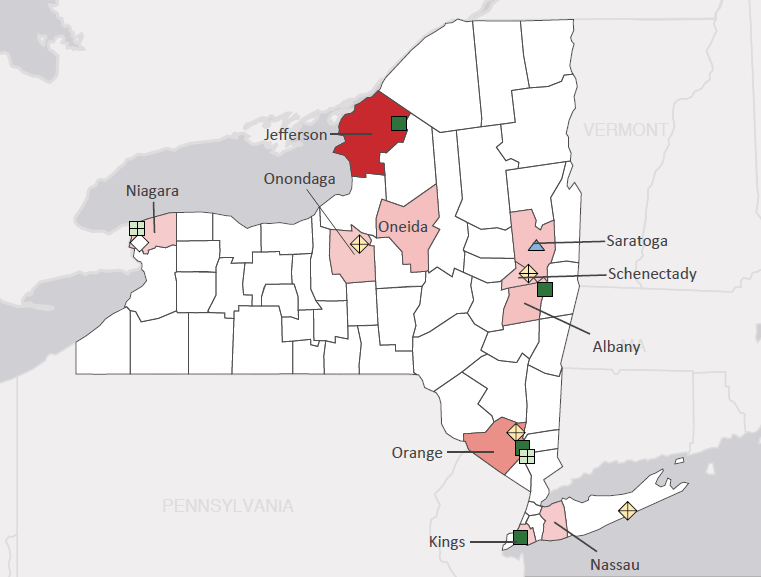 Map presenting top defense personnel spending locations within the state of New York with an overlay showing the positions of key military installations differentiated by service and active/reserve affiliation.