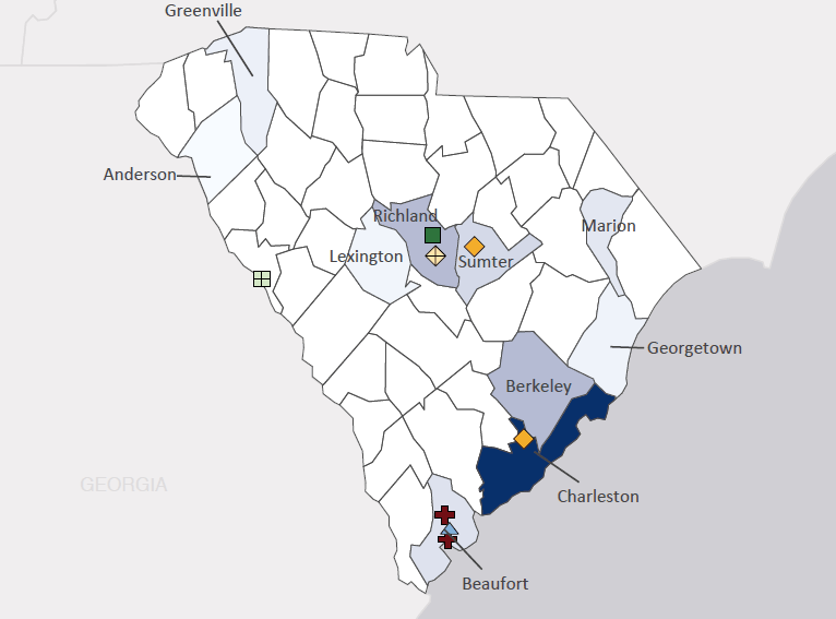 Map presenting top defense contract spending locations within the state of South Carolina with an overlay showing the positions of key military installations differentiated by service and active/reserve affiliation.