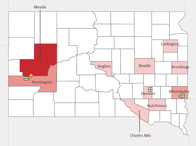 Map presenting top defense personnel spending locations within the state of South Dakota with an overlay showing the positions of key military installations differentiated by service and active/reserve affiliation.