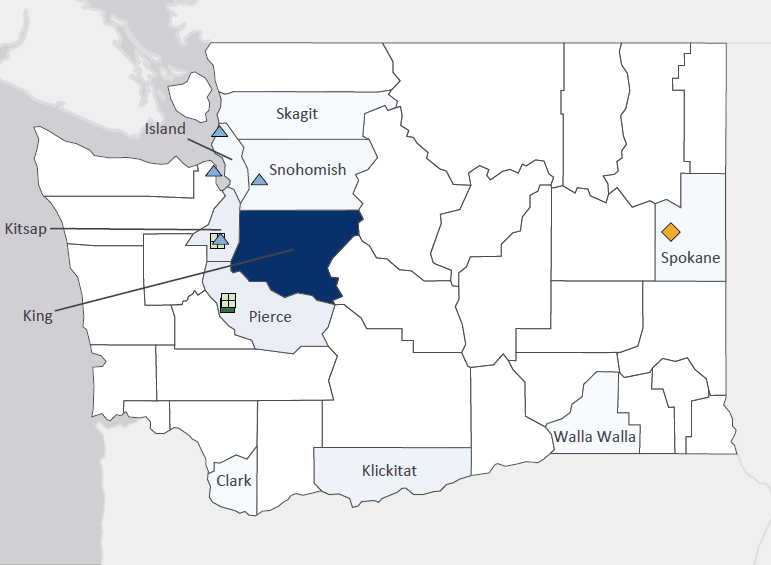 Map presenting top defense contract spending locations within the state of Washington with an overlay showing the positions of key military installations differentiated by service and active/reserve affiliation.